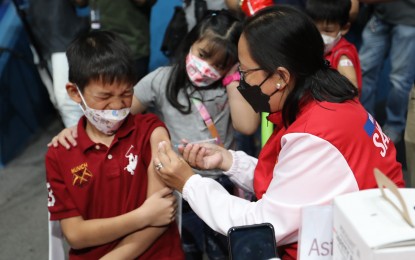 <p><strong>INCLUDE YOUR KIDS</strong>. A kid gets inoculated with the coronavirus disease 2019 (Covid-19) vaccine during the initial rollout for children aged 5 to 11 years at the Fil Oil Flying V Centre, San Juan City on Monday (Feb. 7, 2022). President Rodrigo Duterte urged the public anew to get their Covid-19 vaccine and include their children because it will ensure their health and life in the future. <em>(PNA photo by Joey O. Razon)</em></p>