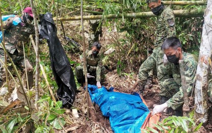 <p><strong>RETRIEVAL OPS.</strong> Army troopers retrieve the remains of a New People’s Army (NPA) combatant identified as Elmer Delarmente Maisog alias “Ebok/Tawtaw" on Monday (Feb. 7, 2022) in Barangay Maraiging, Jabonga, Agusan del Norte. Based on the revelation of a former rebel, Delarmente was killed during the attack on security personnel conducting critical infrastructure and investment protection security operations last Sept. 29, 2021. <em>(Photo courtesy of 29IB)</em></p>