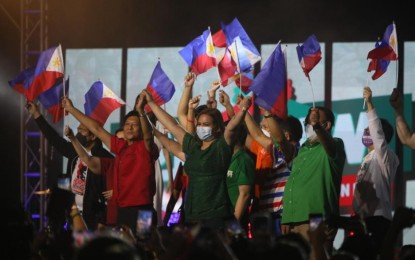 <p><strong>UNITEAM.</strong> Ferdinand Marcos Jr. and Sara Duterte (1st and 2nd from left) kick off their nationwide campaign for president and vice president, respectively, at the Philippine Arena in Bocaue, Bulacan on Tuesday (Feb. 8, 2022). They were joined by their senatorial candidates, led by former presidential spokesperson Harry Roque (3rd from left). <em>(PNA photo by Avito C. Dalan)</em></p>