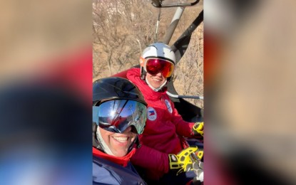 <p><strong>LONE QUALIFIER.</strong> An undated photo shows Asa Miller and dad Kelly ride a chairlift on the way to the training and competition venue. Asa is lone Filipino athletes who qualified in the ongoing 2022 Beijing Winter Olympics. <em>(Contributed photo)</em></p>