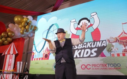 <p><strong>VAX FOR KIDS</strong>. The Quezon City government prepares a magic show to entertain children 5 to 11 years while getting vaccinated against Covid-19 at its pediatric vaccination site at the Elements Centris in this undated photo. The city government has so far vaccinated 3,585 children 5 to 11 years old. <em>(Photo grabbed from QC government Facebook page)</em></p>