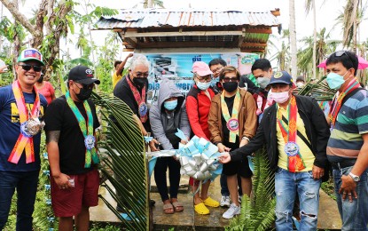 <p><strong>SAFE WATER.</strong> Department of Trade and Industry – Region13 Director Gay Tidalgo (4th from right), together with Vice Gov. Nilo Demerey Jr. (left) and Verdex’s Louie Pacana (3rd from left), leads the launch of a solar-powered desalination equipment in Barangay Cab-ilan of Dinagat town in Dinagat Islands province on Wednesday (Feb. 9, 2022). The equipment will benefit the 270 households in the village, one of the remote barangays in Dinagat town.<em> (Photo courtesy of DTI-13)</em></p>