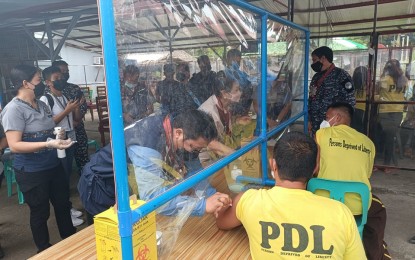 <p><strong>JABS FOR PDLs</strong>. Persons Deprived of Liberty at the Iloilo District Jail in Pototan avail of their booster shots on Feb. 10, 2022 to kick off the third part of the "Bayanihan, Bakunahan 3". Almost 3.5 million were vaccinated during the third run of the national drive from February 10 to 18, the Department of Health reported Saturday (February 19). <em>(Photo courtesy of Department of Health-Western Visayas)</em></p>