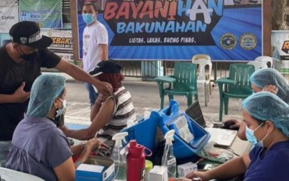 <p><strong>COVID-19 JAB</strong>. A resident of Talisay City, Negros Occidental gets jabbed against Covid-19 during Day 2 of the third run of the National Vaccination Days on Friday (Feb. 11, 2022). During the first day on Thursday, some 15,370 Negrenses were vaccinated in all 31 localities and seven provincial government-owned hospitals. <em>(Photo courtesy of PIO Negros Occidental)</em></p>