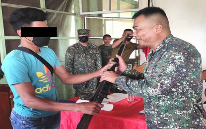 <p><strong>GOING BACK TO A PEACEFUL LIFE</strong>. Three members of the Abu Sayyaf Group (ASG) surrender on Feb. 10, 2022 to the 4th Marine Brigade in Sulu. One of the three ASG surrenderers handed over a rifle to Col. Vicente Mark Anthony Blanco III, 4th Marine Brigade commander, when they surrendered. <em>(Photo courtesy of the 4th Marine Brigade)</em></p>