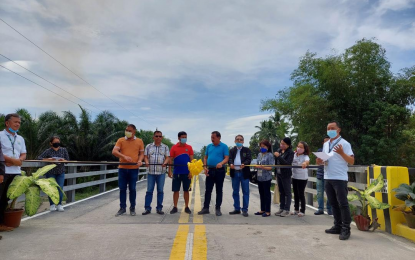 <p><strong>NEW BRIDGE.</strong> An undated photo shows the turnover ceremony of the P10.9-million bridge project between the Department of Agrarian Reform and the residents of Barangay San Jose in Norala, South Cotabato. Some 6,000 residents will benefit from the new bridge.<em> (Photo courtesy of DAR)</em></p>