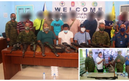 <p><strong>TIRED COMBATANTS.</strong> Local police and military officials pose with 12 of the 13 Bangsamoro Islamic Freedom Fighters (BIFF) who surrendered to the Army’s 34th Infantry Battalion (IB) in Barangay Salunayan, Midsayap, North Cotabato on Monday (Feb. 14, 2022). On the same day, a 14th BIFF member (inset) handed over his rifle to Mayor Ramil Dilangalen of neighboring Northern Kabuntalan, Maguindanao during surrender rites also inside the 34IB base. <em>(Photo courtesy of 34IB)</em></p>