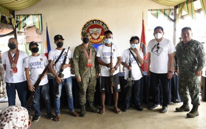 <p><strong>ASG SURRENDERERS.</strong> The Joint Task Force (JTF)-Sulu hands over four Abu Sayyaf Group (ASG) surrenderers (holding rifles) on Wednesday (Feb. 16, 2022) to the Municipal Task Force in Ending Local Armed Conflict (MTF-ELAC) of Luuk, Sulu. The four ASG surrendered to the 4th Marine Brigade based in the town of Luuk and will undergo a reintegration program to become productive and responsible citizens. <em>(Photo courtesy of JTF-Sulu)</em></p>