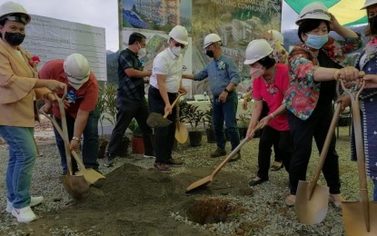 <p><strong>NEW HOUSING PROJECT</strong>. Baguio City Mayor Benjamin Magalong (center right) and DHSUD Secretary Eduardo del Rosario (Center left) lead the groundbreaking ceremony of a housing project in Barangay Irisan, Baguio City on Sunday (Feb. 20, 2022). The project will benefit 273 identified informal settler families. <em>(Photo courtesy of DHSUD-CDMRD)</em></p>