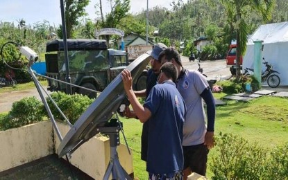 <p><strong>ENSURING CONNECTIVITY</strong>. Members of the Technical staff of DICT-13 install a Very Small Aperture Terminal (VSAT) in Burgos, Siargao Island, in Surigao del Norte on Sunday (Feb. 20, 2022). A total of six VSATs are already providing communications services in the towns of Dapa, Burgos, Pilar, San Benito, San Isidro, and Sta. Monica. <em>(Photo courtesy of DICT-13 Information Office)</em></p>