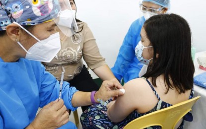 <p><strong>PEDIA JAB.</strong> A healthcare worker prepares to inoculate a girl against the coronavirus disease 2019 during the launch of vaccination of children aged 5 to 11 years old in Cagayan de Oro City on Feb. 14, 2022. In a week, the city logged more than 5,000 inoculations under the youngest pedia category. <em>(Photo courtesy of CDO CIO)</em></p>