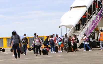 <p><strong>LAST REPATRIATION FLIGHT</strong>. Returning Filipinos from Palau arrive onboard the last repatriation flight of the Philippine Airlines (PAL) at the Subic Bay International Airport on Tuesday (Feb. 22, 2022). PAL made a total of 82 repatriation flights, bringing home a total of 20,522 passengers. <em>(Photo courtesy of SBMA)</em></p>