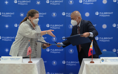 <p><strong>PARTNERSHIPS.</strong> US Embassy Chargé d’Affaires Heather Variava, acting honorary chairperson of the Philippine-American Educational Foundation Board of Directors, and Philippine Space Agency Director General Joel Joseph Marciano, sign a memorandum of understanding (MOU) at the PAEF office in Mandaluyong City on Feb. 17, 2022. The MOU seeks to establish scholarship and training programs for space science. <em>(Photo courtesy of PhilSA)</em></p>