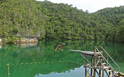 <p><strong>BUSINESS AS USUAL.</strong> This photo, taken in October 2021, shows the iconic diving board at the Sugba Lagoon. The famous Sugba Lagoon in Del Carmen town in Siargao Island, Surigao del Norte is set to resume operations starting Friday (Feb. 25, 2022) more than two months after the devastations of Typhoon Odette. <em>(Contributed photo by Ivy Marie Mangadlao)</em></p>