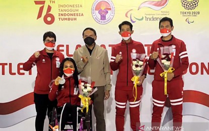 <p>Para-powerlifting coach Yanti (screenshot left to right), lifter Ni Nengah Widiasih, Youth and Sports Minister Zainudin Amali, and para-cycling athlete Muhammad Fadli Imammuddin after returning from Tokyo 2020 Paralympics at Soekarno-Hatta Airport, Tangerang, Saturday (Feb. 26, 2022). <em>(ANTARA/Shofi Ayudiana/aa/KT)</em></p>