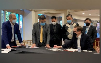 <p><strong>SATELLITE SERVICES.</strong> Trade Undersecretary and Board of Investments managing head Ceferino Rodolfo (second from left) meets SpaceX senior manager for market access Brian Schepis (seated) on Nov. 16, 2021. SpaceX, founded by billionaire Elon Musk, eyes to put up Starlink internet satellite services in the Philippines.<em> (Photo courtesy of BOI)</em></p>