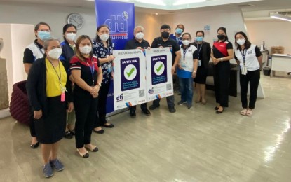 <p><strong>SAFETY SEAL</strong>. DTI officials led by its Cebu director Rosa Mae Quiñanola hands over safety seal certification to two branches of Isuzu in Cebu on Wednesday (March 2, 2022) at the DTI-Cebu provincial office. To ensure continuous observance of health protocols, the DTI-Cebu issued a total of 159 new certifications since May 2021 and 22 renewals approved since December 2021. <em>(Photo courtesy of DTI-Cebu)</em></p>