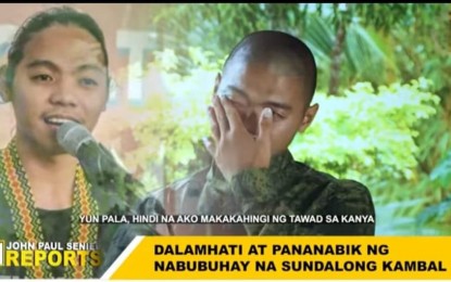 <p><strong>DREAM REUNION.</strong> Philippine Army trainee Gelejurain l Alce Nguho sheds tears upon hearing the news that his beloved twin brother Gelejurain lI who joined the communist New People’s Army was killed in an encounter with government forces in Davao de Oro on Feb. 24, 2022. He said in the John Paul Seniel Reports aired online on Tuesday (March 1) that their dream reunion was no longer possible because of his brother's death. <em>(Screengrab photo from John Paul Seniel Reports)</em></p>