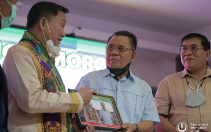 <p><strong>BARMM VISIT.</strong> Senator Francis Tolentino (right) is welcomed by Bangsamoro Autonomous Region in Muslim Mindanao Chief Minister Ahod Ebrahim (center) following a visit to the BARMM center in Cotabato City on Wednesday (March 2, 2022). The BARMM officials expressed gratitude to the senator for pushing the enactment of Republic Act 11593, an Act resetting the first regular election in BARMM to 2025, which extended the region’s transition period. <em>(Photo courtesy of Bangsamoro Information Office - BARMM)</em></p>