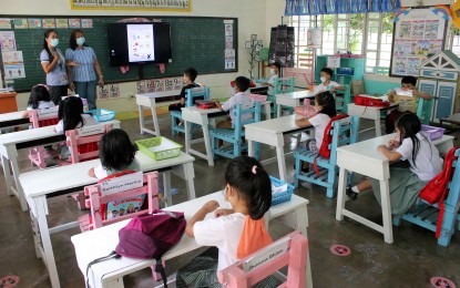 <p><strong>LEARNING TIME.</strong> Grade 3 students at the New Era Elementary School in Barangay New Era, Sampaloc 5, City of Dasmariñas, Cavite on March 3, 2022. Budget Secretary Amenah Pangandaman has approved the release of funds worth PHP303.5 million for the construction of 120 classrooms in 21 sites nationwide. <em>(PNA file photo by Gil Calinga)</em></p>
