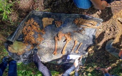 <p><strong>NPA EXECUTION VICTIM</strong>. The remains of Ritchel Daydayan, alias Toto Seloy, a victim of the NPA’s execution, is exhumed by troops of the 27th Infantry Battalion, 1003rd Brigade,  Air Intelligence and Security Squadron Philippine Air Force, and Philippine National Police Forensic Unit 11 at the forested area of Pintoy Hill, Purok Banban, Barangay Lumiad, Paquibato District in Davao City on Friday (March 4, 2022). Daydayan is said to be a victim of the NPA’s “Kangaroo Court” or “Hukumang Bayan”.<em> (Photo courtesy of 10ID)</em></p>