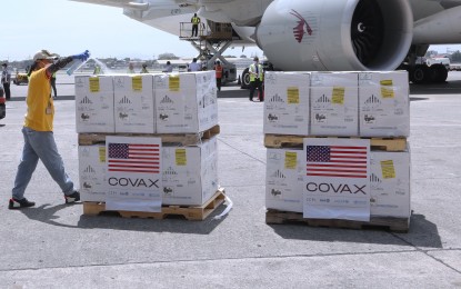 <p><strong>KEEPING ‘EM CLEAN.</strong> Boxes of United States-donated Pfizer Covid-19 vaccines are sprayed with disinfectant at the Ninoy Aquino International Airport Terminal 1 in Parañaque City on Monday (March 7, 2022). The Philippines has so far received 231,505,650 doses of Covid-19 jabs. <em>(PNA photo by Joey O. Razon)</em></p>