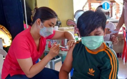 <p><strong>JABBED.</strong> A boy in San Carlos City, Negros Occidental gets vaccinated against Covid-19 on the last week of February. This week, the province is set to receive an additional 25,000 doses of Pfizer-BioNTech jabs for children aged 5 to 11, Provincial Administrator Rayfrando Diaz II said on Monday (March 7, 2022). <em>(Photo courtesy of NegOcc-San Carlos City Information Office)</em></p>