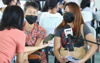 <p><strong>LOOKING FORWARD.</strong> Fe Vinoya is happy that she is finally going back to Bicol with her 81-year old mother and two children through the Balik Probinsya Bagong Pag-Asa program. In the province, she said she can focus on taking care of her mother and kids. <em>(PNA photo by Robert Alfiler)</em></p>