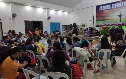 <p><strong>DISPLACED.</strong> Evacuees, who were brought to a local church used as a temporary shelter for flood and landslide victims in Lake Sebu, South Cotabato, are attended to by workers of the town disaster management office on Wednesday (March 9, 2022). At least 300 individuals from the town’s Barangays Takunel and Poblacion were evacuated after floodwaters caused by moderate to heavy rains the past two days prevailed in the area. <em>(Photo courtesy of Rolly Doanne Aquino – SoCot PDRRMO)</em></p>