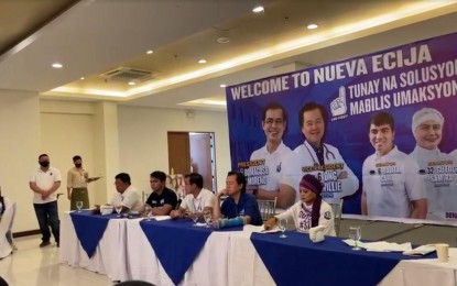 <p><strong>NO TO COMMUNISTS.</strong> Presidential bet Francisco “Isko Moreno” Domagoso (center, seated) and his fellow Aksyon Demokratiko candidates face the media in Cabanatuan City on Friday (March 11, 2022). He stressed that he will never involve insurgents in his administration. <em>(Screengrab)</em></p>