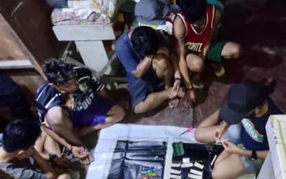 <p><strong>DRUG DEN RAID.</strong> Photo shows the four suspects, including a drug den maintainer, after their arrest during an anti-illegal drug operation in Salvador Extention, Barangay Labangon, Cebu City on Thursday night (March 10, 2022). Another raid was launched in Barangay Calamba that led to the arrest of eight people, including the drug den operator. <em>(Photo courtesy of PDEA-7) </em></p>