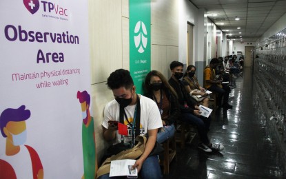 <p><strong>SAFE DISTANCE.</strong> Workers queue for Covid-19 vaccines at the Teleperformance Center Ayala in Makati City on March 8, 2022. The event preceded the fourth national vaccination days on March 10 to 12 and underscored the government’s drive to provide protection to front-liners and hasten the country’s economic recovery. <em>(PNA photo by Jess M. Escaros Jr.)</em></p>