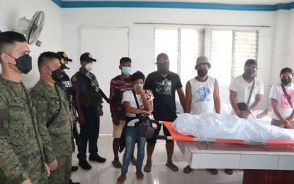 <p><strong>REBEL’S REMAINS</strong>. Troops of the Army’s 62nd Infantry Battalion and personnel of the Isabela Municipal Police Station in Negros Occidental turn over the remains of CPP-NPA leader and notorious hitman Virgilio “Kumander Bedam” Tamban to his family at the Leo Memorial Chapels on March 10, 2022. Tamban and his comrade Ben Jack “Ka Yuhan” Rueles were killed in a clash with soldiers in Barangay Amin, Isabela town early morning of March 9.<em> (Photo courtesy of 62nd Infantry Battalion, Philippine Army)</em></p>