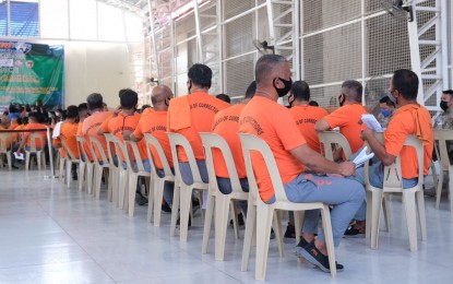 <p><strong>INMATES’ TURN.</strong> Inmates at the New Bilibid Prison maximum security compound in Muntinlupa City queue for Covid-19 vaccines on Saturday (March 12, 2022). The Bureau of Corrections said 27,879 of the nearly 50,000 persons deprived of liberty under their jurisdiction are fully inoculated as of March 14. <em>(Photo courtesy of NTF)</em></p>
