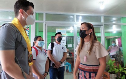 <p><strong>HOUSING PROJECT.</strong> ACTED-Philippines Country Director Fabien Courteille (left) meets with Sison, Surigao del Norte Mayor Karissa Fetalvero-Paronia on Monday (March 14, 2022) to finalize the start of the rebuilding of the houses severely damaged by Typhoon Odette in December last year. ACTED-Philippines and the Sison town government will jointly rebuild 100 damaged houses in three barangays. <em>(Photo grabbed from Sison on the Rise FB Page)</em></p>