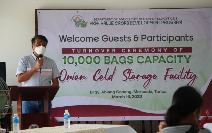 <p><strong>COLD STORAGE FACILITY</strong>. Department of Agriculture Executive Regional Director Crispulo G. Bautista Jr. delivers his message during the turnover ceremony of a PHP20-million onion cold storage facility to the Sapang Multi-Purpose Cooperative in Barangay Ablang Sapang, Moncada, Tarlac on Wednesday (March 16, 2022). The facility can store 10,000 bags of dry bulb onions and prolong their shelf life for six to eight months. <em>(Photo courtesy of DA-3)</em></p>