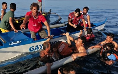 <p><strong>RESCUE AT SEA</strong>. Personnel of the Zambales Maritime Police Station and local fishermen rescue the pilot and passengers of a private plane that crashed off the shore of Iba, Zambales on Thursday (March 17, 2022). The victims were brought to the President Ramon Magsaysay Provincial Hospital in the said town<em>. (Photo courtesy of Zambales Maritime Police Station)</em></p>