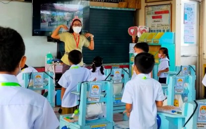 <p><strong>LIMITED.</strong> Select students attend classes at Mapagong Elementary School in Calamba City, Laguna on March 14, 2022. The school distributed alcohol, learning materials, and other back-to-school treats to welcome back learners. <em>(Photo courtesy of DepEd Calabarzon)</em></p>