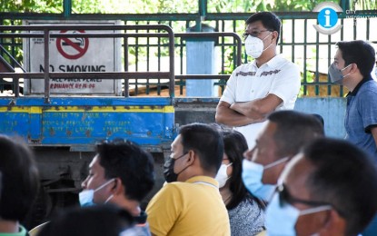 <p><strong>PROPOSED LNG PLANT</strong>. Mayor Renato Gustilo of San Carlos City, Negros Occidental (standing, 2nd from right) attends the public scoping for the proposed 300-megawatt liquefied natural gas combined cycle power plant at the Barangay Punao covered court on Wednesday (March 16, 2022). The PHP18.5-billion project was proposed by Reliance Energy Development Inc., a wholly-owned subsidiary of SMC Global Power Holdings Corporation. <em>(Photo courtesy of San Carlos City Information Office)</em></p>