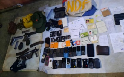<p><strong>SEIZED.</strong> The firearms, explosives, mobile phones and other items recovered by the military and police during a joint law enforcement operation that led to the arrest of CPP-NPA leader Ramon “Using” Patriarca and his two comrades in Barangay Su-ay, Himamaylan City, Negros Occidental on Friday (March 18, 2022). Patriarca, deputy secretary and finance officer of Komiteng Rehiyon-Negros, is facing 10 counts of murder before the Regional Trial Court Branch 47 in Tagbilaran City, Bohol. <em>(Photo courtesy of 303rd Infantry Battalion, Philippine Army)</em></p>