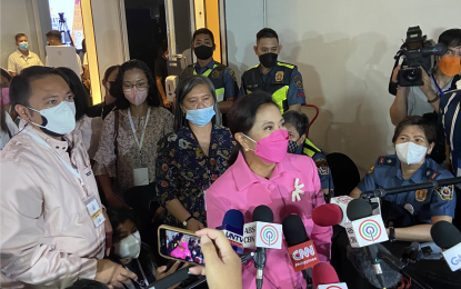 <p><strong>BEST FOR THE JOB.</strong> Presidential aspirant Leni Robredo answers queries from the media after the Comelec’s first “PiliPinas Debates 2022” at the Sofitel Hotel tent in Pasay City on Saturday (March 19, 2022). Robredo said the best man for the job in the May 9 presidential race is a woman. <em>(PNA photo by Ferdinand Patinio)</em></p>