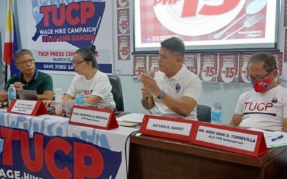 <p><strong>WAGE HIKE</strong>. TUCP Party-list Rep. Raymond Democrito Mendoza (second from right) stresses a point during a press conference before the group filed a PHP430 wage increase petition before the Regional Tripartite Wages and Productivity Board in Central Visayas on Monday (March 21, 2022). Mendoza said the last increase of PHP18 was granted in 2019. <em>(PNA photo by John Rey Saavedra)</em></p>