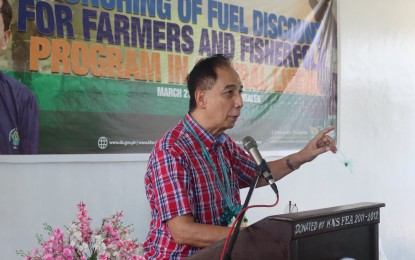 <p><strong>FUEL SUBSIDY</strong>. Agriculture Secretary William Dar delivers his message during the rollout of fuel subsidy discount cards to qualified corn farmers and fisherfolk in Central Luzon on Monday (March 21, 2022). In partnership with the Development Bank of the Philippines and Universal Storefront Services Corporation, more than 200 eligible beneficiaries initially received their P3,000 worth of fuel subsidy card during the distribution held in Subic, Zambales. <em>(Photo courtesy of DA-3)</em></p>