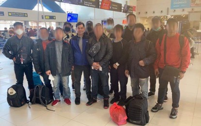 <p><strong>REPATRIATED</strong>. The 12 Filipino seafarers who were repatriated from Ukraine with the staff of the Philippine Embassy in Budapest. They arrived in the Philippines on Tuesday (March 22, 2022) and were welcomed by the DFA-Consular Office in Angeles personnel. <em>(Photo courtesy of Philippine Embassy in Budapest)</em></p>