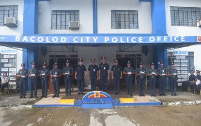 <p><strong>TYPHOON AID.</strong> Personnel of Bacolod City Police Office affected by Typhoon Odette receive financial aid of PHP4,000 each during the flag-raising rites at the headquarters led by Col. Thomas Joseph Martir, police city director, on Monday (March 21, 2022). The financial aid was released by the PNP national office through the Finance Service of Police Regional Office-Western Visayas.<em> (Photo courtesy of Bacolod City Police Office)</em></p>