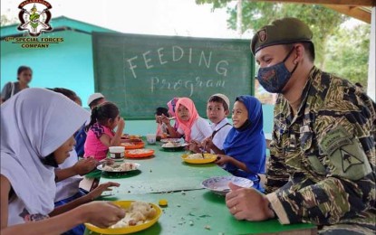 <p><strong>FEEDING PROGRAM.</strong> The Army's 6th Special Forces Company, in partnership with various stakeholders, launches the month-long feeding program on Monday (March 21, 2022) to entice more than 100 learners in Bud Bunga, Talipao, Sulu, to pursue their studies. The learners include children of Abu Sayyaf Group (ASG) surrenderers. <em> (Photo courtesy of 6SFC )</em></p>