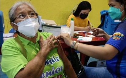 <p><strong>ALERT LEVEL 2</strong>. A senior citizen avails of the Covid-19 vaccination at the Binirayan Gymnasium in San Jose de Buenavista, Antique on Jan. 27, 2022. Antique inter-agency task force (IATF) action officer Margie Gadian on Friday (May 20, 2022) encouraged other seniors to avail of the Covid-19 vaccination so the province could be classified under Alert Level 1. <em>(File photo courtesy of Antique IPHO)</em></p>
