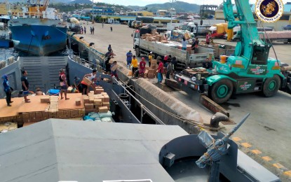 <p><strong>RELIEF MISSION</strong>. Personnel from the Philippine Navy unload relief goods and construction materials from Landing Craft 295 BRP Tausug at the Surigao City Port in this undated photo. The Naval Forces Central on Wednesday (March 23, 2022) said naval vessels continue to send assistance to areas more than three months since the onslaught of Typhoon Odette in December last year. <em>(Photo courtesy of Naval Forces Central PAO)</em></p>