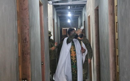<p><span style="line-height: 1.5;"><strong>NEW FACILITIES.</strong> Maj. Arturo A. Llaso, the division chaplain of the Philippine Army's 7th Infantry Division, blesses the new facilities inside the headquarters of the 91st Infantry Battalion at Camp Jaime Bitong Jr. in Baler, Aurora on Thursday (March 24, 2022). The new camp facilities include a gym, sleeping quarters, and office<em>. (Photo by Jason de Asis)</em></span></p>
