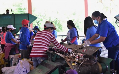 <p><strong>TRASH TO TREASURE.</strong> Workers are seen in this undated photo segregating garbage at the Central Materials Recovery Facility of the Dumaguete City government. Environmental Management Bureau-Central Visayas (EMB-7) regional director William Cuñado and Mayor Felipe Antonio Remollo led Thursday (March 24, 2022) the formal inauguration of the facility in Barangay Candauay in the Negros Oriental capital. <em>(Photo courtesy of Lupad Dumaguete Facebook page/City PIO)</em></p>